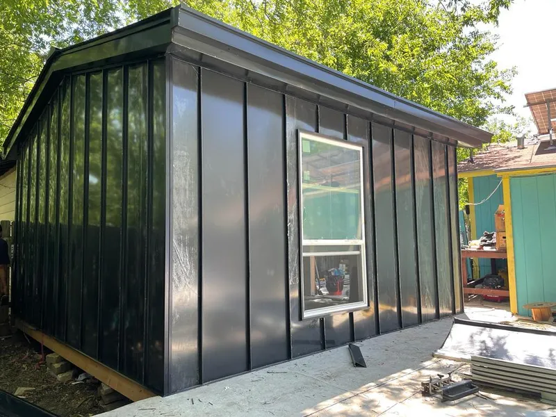 Black standing seam metal wall panels for Metal Roof Installation in Pleasant View