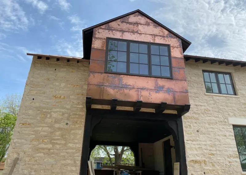 Copper metal panel facade on a stone building for Metal Roof Coating in Pleasant View