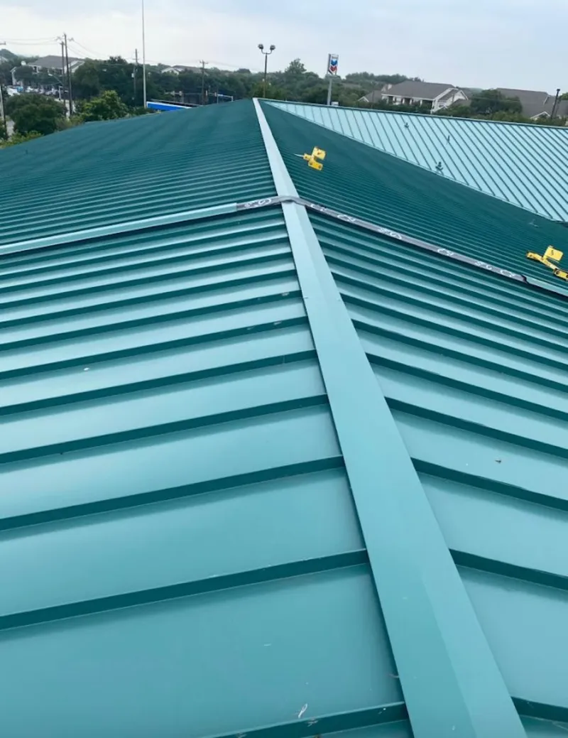 Green commercial metal roof ridge and valley for Metal Roof Repair in Pleasant View